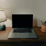 macbook pro on brown wooden table