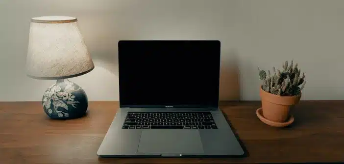 macbook pro on brown wooden table